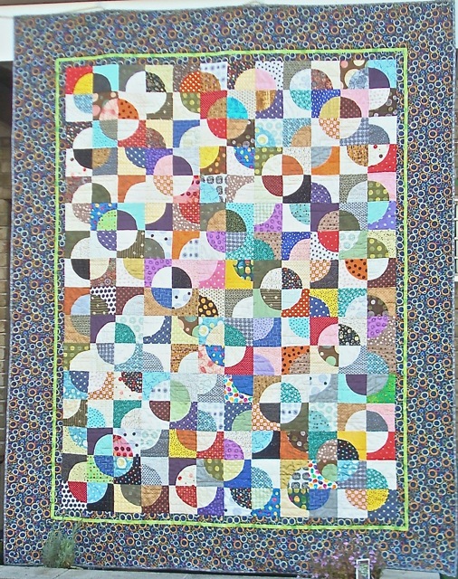 Got Dots looks awesome finished.  My only problem is that I did very complex border quilting and you can't see it at all (which is actually a good thing, since it didn't turn out as nicely as I had envisioned.)